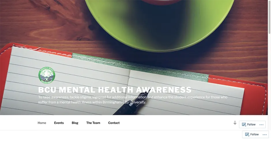 Screenshot of the BCU Mental Health Awareness site homepage with a green mug and notebook background and white header text.
