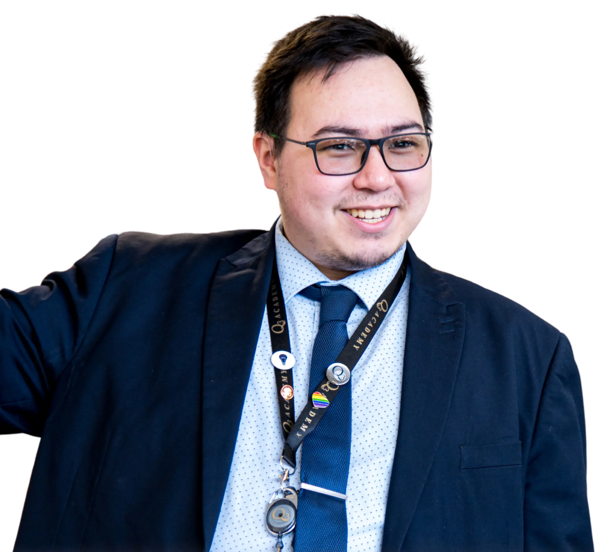 Professional headshot of a smiling man wearing a suit, glasses, and academy lanyard, isolated on a transparent background.